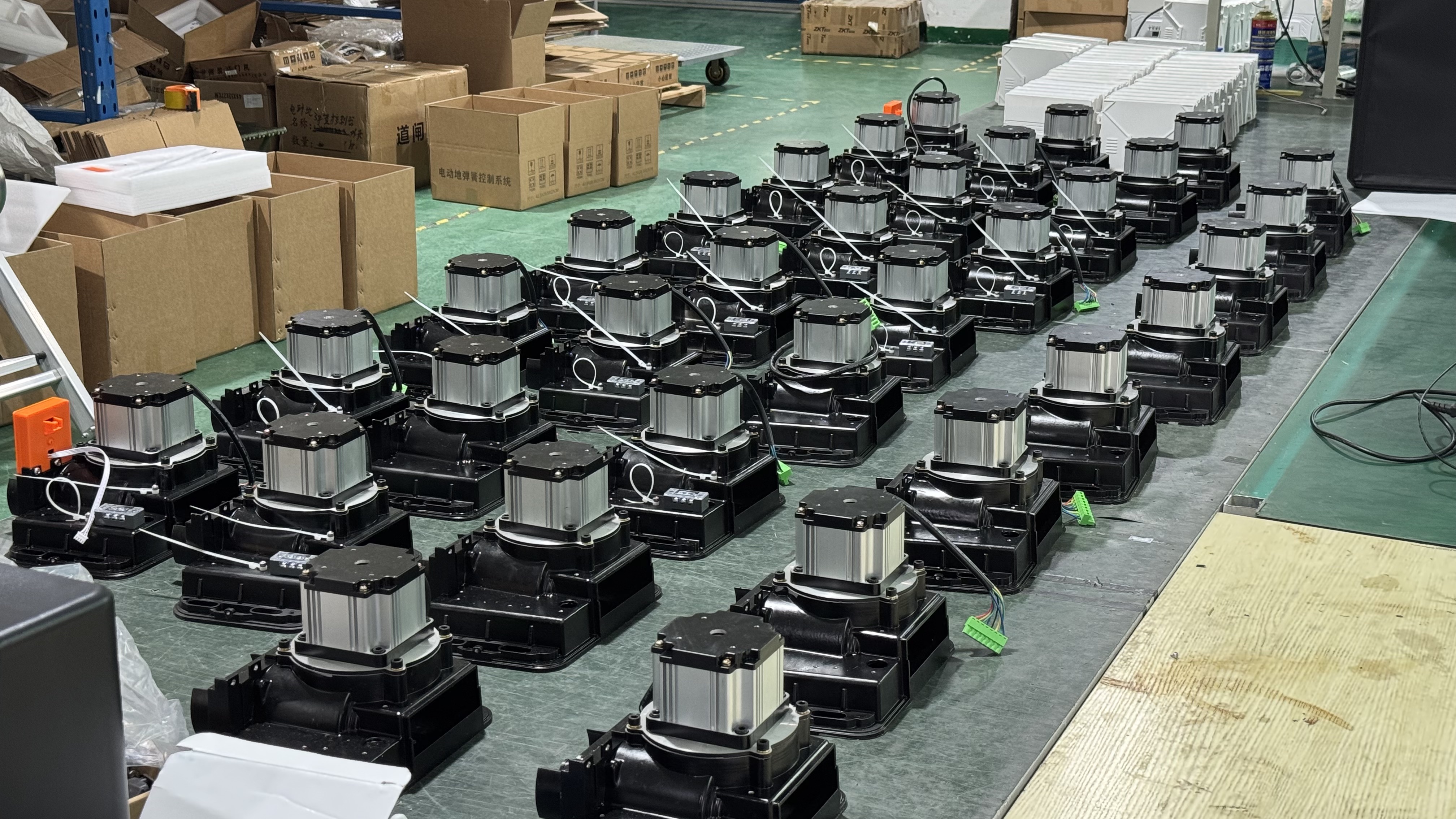 Buyer inspecting an Open Bear sliding gate motor at the Shenzhen factory